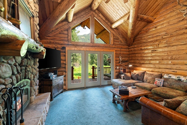 421 Swanson Lodge Rd, Troy, MT 59935 - living room with wooden ceiling with exposed beams, french doors, rustic walls, carpet, and a stone fireplace
