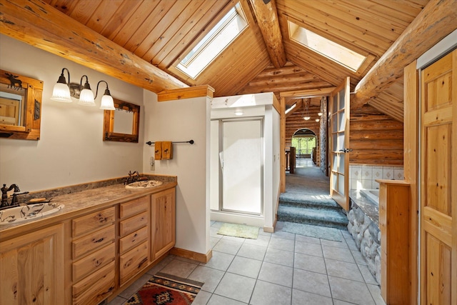 421 Swanson Lodge Rd, Troy, MT 59935 - bathroom with a skylight, rustic walls, tile patterned flooring, a tub to relax in, and double vanity
