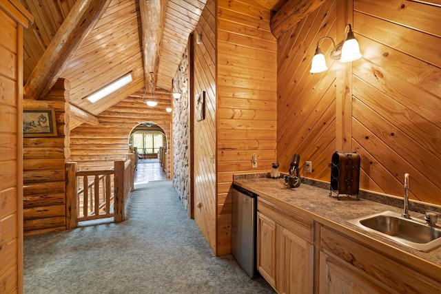421 Swanson Lodge Rd, Troy, MT 59935 - indoor wet bar featuring carpet, log walls, and decorative light fixtures