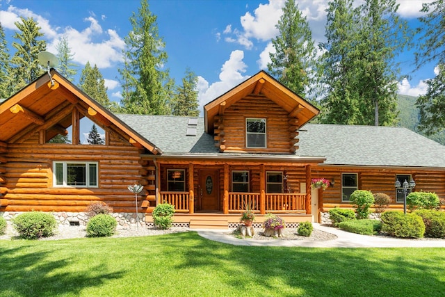 421 Swanson Lodge Rd, Troy, MT 59935 - view of front of house with log exterior, a porch, and a front yard
