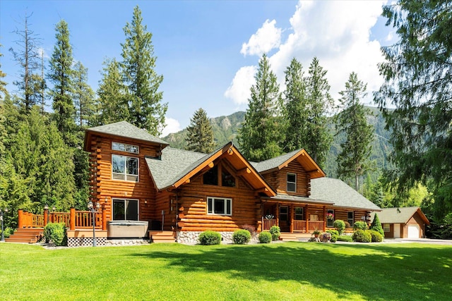 421 Swanson Lodge Rd, Troy, MT 59935 - rear view of property featuring log exterior, a porch, and a lawn