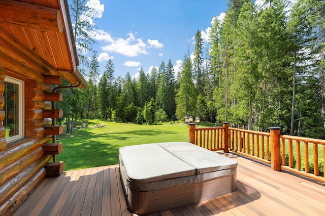 421 Swanson Lodge Rd, Troy, MT 59935 - deck featuring a covered hot tub, a lawn, and a wooded view