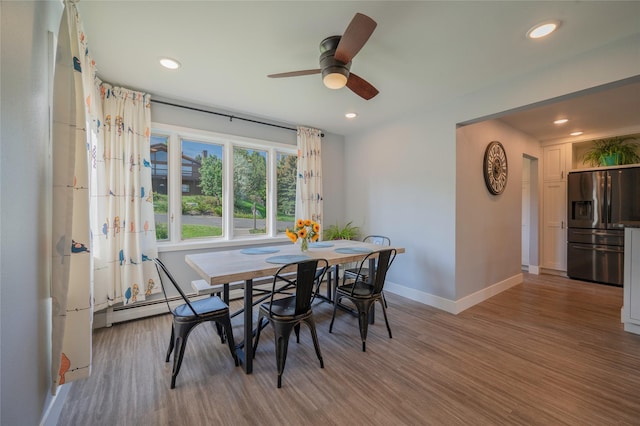 1520 Highland St, Helena, MT 59601 - dining room featuring baseboards, wood finished floors, a ceiling fan, recessed lighting, and baseboard heating