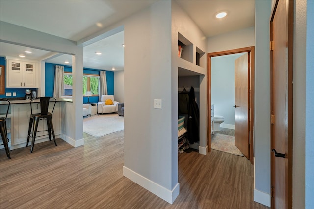 1520 Highland St, Helena, MT 59601 - hall featuring baseboards, wood finished floors, and recessed lighting