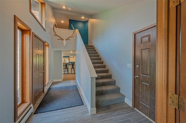 1520 Highland St, Helena, MT 59601 - foyer entrance with a towering ceiling, stairs, wood finished floors, baseboards, and baseboard heating