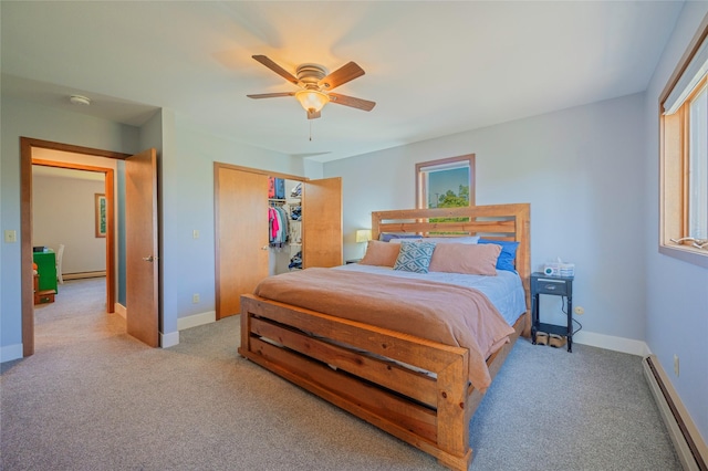 1520 Highland St, Helena, MT 59601 - carpeted bedroom with a baseboard radiator, baseboards, a ceiling fan, and a closet