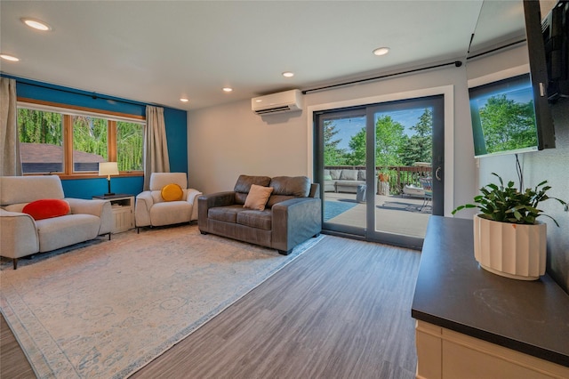1520 Highland St, Helena, MT 59601 - living room featuring an AC wall unit, recessed lighting, and wood finished floors