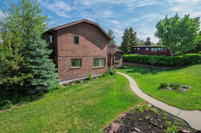 1520 Highland St, Helena, MT 59601 - view of side of home with a lawn and brick siding