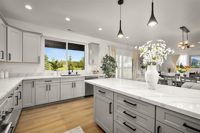 208 Cowboy Dr, Columbia Falls, MT 59912 - kitchen with stainless steel dishwasher, gray cabinetry, a sink, hanging light fixtures, and recessed lighting