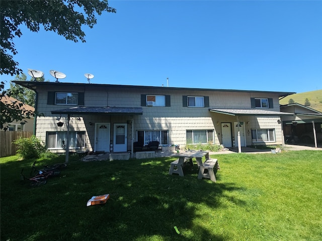 901 Rodgers St Unit 7, Missoula, MT 59802 - rear view of property featuring an attached carport