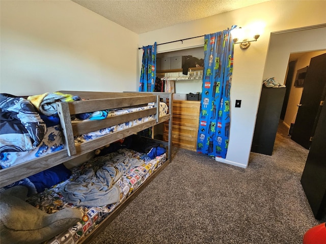 901 Rodgers St Unit 7, Missoula, MT 59802 - carpeted bedroom with a textured ceiling and baseboards