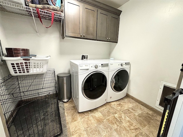 3075 Callaway Dr, East Helena, MT 59635 - laundry area with cabinet space, washing machine and clothes dryer, baseboards, and stone finish floors