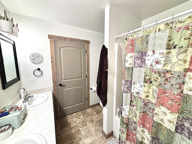 3075 Callaway Dr, East Helena, MT 59635 - bathroom with double vanity and stone finish floors