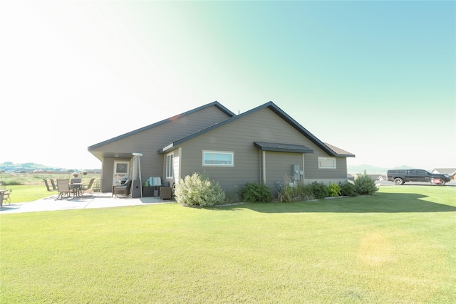 3075 Callaway Dr, East Helena, MT 59635 - rear view of property featuring a patio and a yard