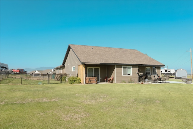 3075 Callaway Dr, East Helena, MT 59635 - back of property with a patio area and roof with shingles
