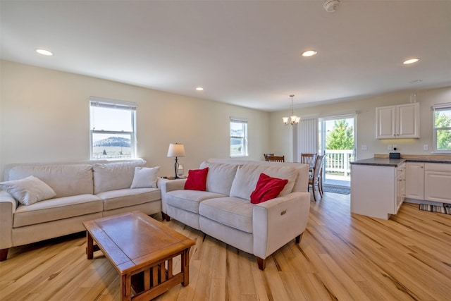 5196 Stallion Ridge Dr, Helena, MT 59602 - living room featuring a chandelier, light wood-type flooring, and recessed lighting