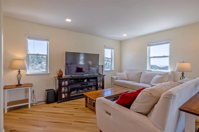 5196 Stallion Ridge Dr, Helena, MT 59602 - living area featuring healthy amount of natural light, light wood-style floors, recessed lighting, and baseboards