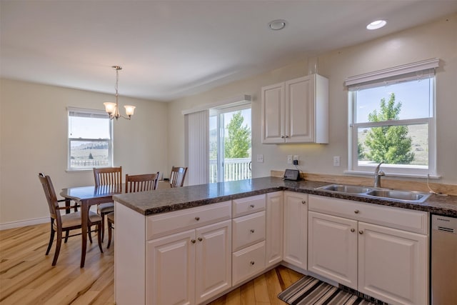 5196 Stallion Ridge Dr, Helena, MT 59602 - kitchen featuring a sink, dishwasher, plenty of natural light, light wood finished floors, and recessed lighting
