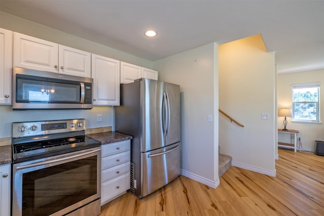5196 Stallion Ridge Dr, Helena, MT 59602 - kitchen featuring stainless steel appliances, light wood-type flooring, white cabinets, baseboards, and recessed lighting