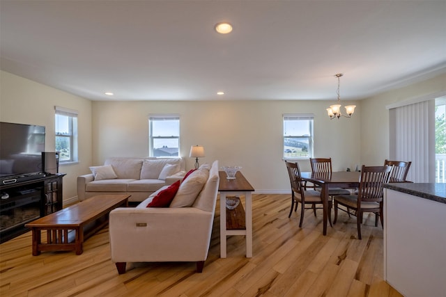 5196 Stallion Ridge Dr, Helena, MT 59602 - living room featuring a chandelier, plenty of natural light, light wood-type flooring, and recessed lighting