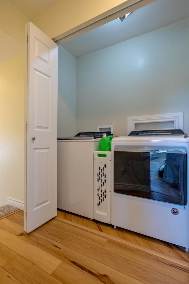 5196 Stallion Ridge Dr, Helena, MT 59602 - kitchen featuring washing machine and dryer and light wood finished floors
