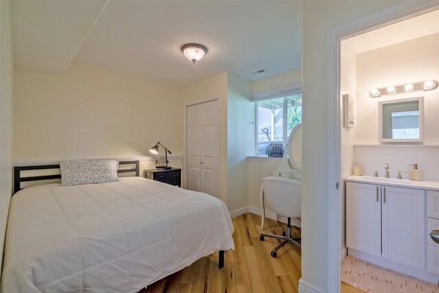 5196 Stallion Ridge Dr, Helena, MT 59602 - bedroom featuring a sink, light wood-style floors, baseboards, and a closet