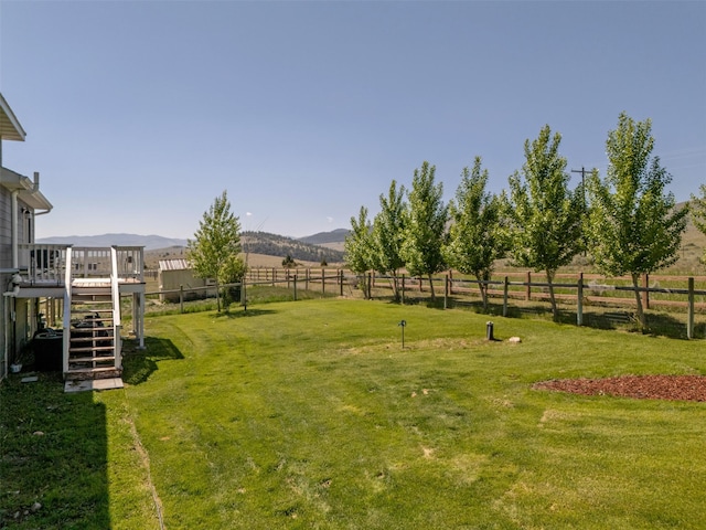 5196 Stallion Ridge Dr, Helena, MT 59602 - view of yard featuring stairs and a deck with mountain view