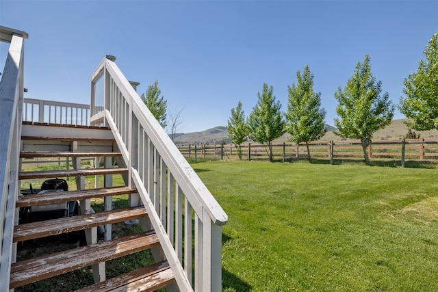 5196 Stallion Ridge Dr, Helena, MT 59602 - view of yard featuring a rural view, stairway, and a mountain view