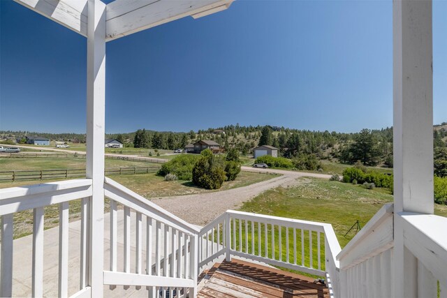 5196 Stallion Ridge Dr, Helena, MT 59602 - porch featuring a rural view and a yard