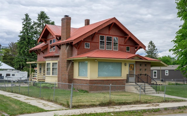 412 1st Ave E, Eureka, MT 59917 - view of front of house featuring a chimney, metal roof, and a standing seam roof