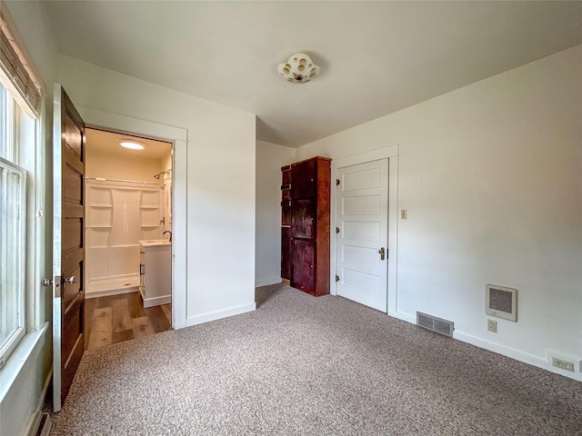 412 1st Ave E, Eureka, MT 59917 - unfurnished bedroom with carpet floors and baseboards