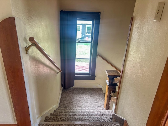 412 1st Ave E, Eureka, MT 59917 - staircase with a textured wall and carpet