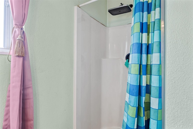 424 4th Ave, Victor, MT 59875 - full bath with curtained shower and a textured wall