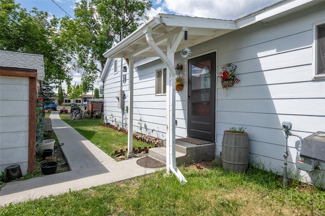 424 4th Ave, Victor, MT 59875 - doorway to property featuring a lawn