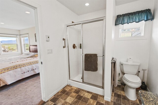 760 Lundeen Rd, Eureka, MT 59917 - ensuite bathroom with baseboards, a stall shower, healthy amount of natural light, and recessed lighting