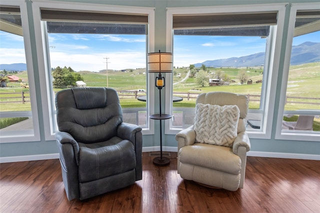 760 Lundeen Rd, Eureka, MT 59917 - living area featuring baseboards, a mountain view, and wood finished floors