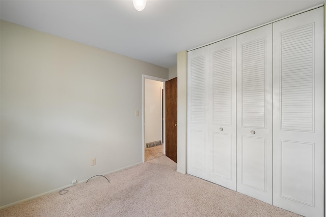 303 Sharon Ct, Anaconda, MT 59711 - unfurnished bedroom featuring carpet, a closet, and baseboards