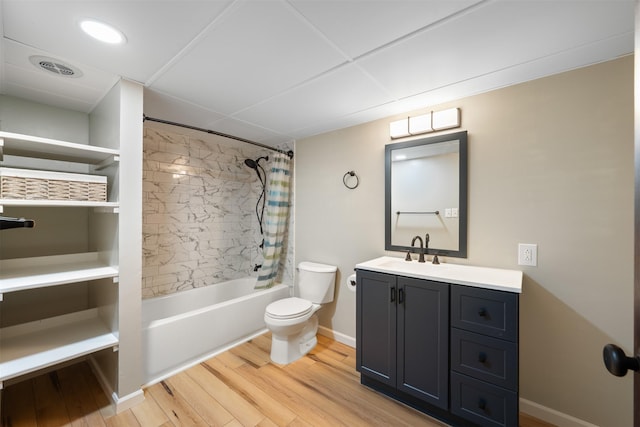 303 Sharon Ct, Anaconda, MT 59711 - bathroom featuring toilet, shower / tub combo, wood finished floors, vanity, and baseboards