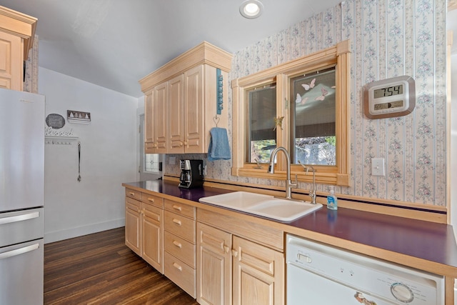 21347 Hydeaway Rd, Rollins, MT 59931 - kitchen featuring freestanding refrigerator, white dishwasher, light brown cabinets, wallpapered walls, and dark wood-type flooring