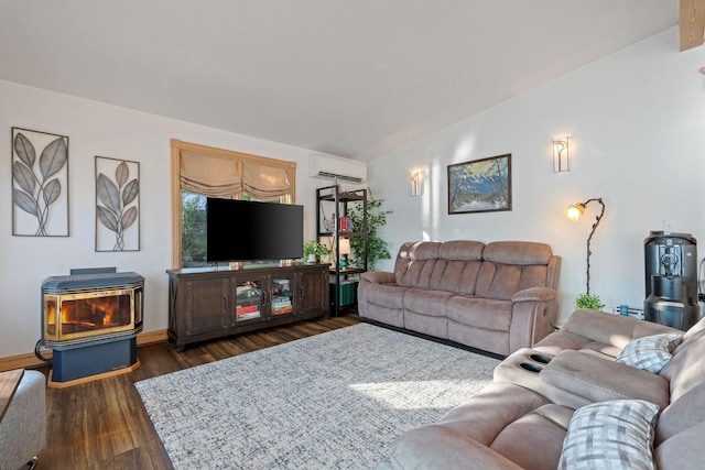21347 Hydeaway Rd, Rollins, MT 59931 - living room with a wall mounted AC, dark wood-type flooring, a wood stove, and lofted ceiling