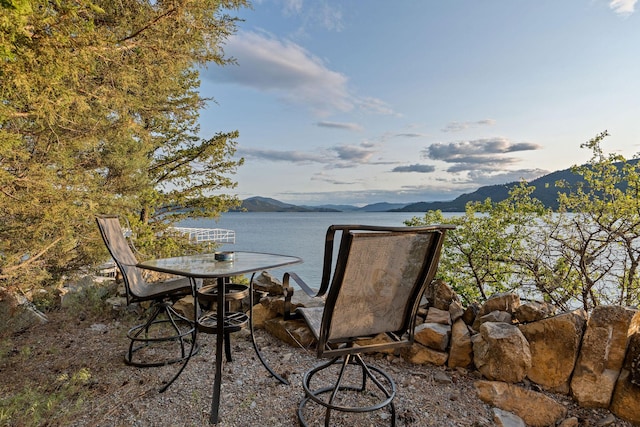 21347 Hydeaway Rd, Rollins, MT 59931 - view of patio / terrace with a water and mountain view