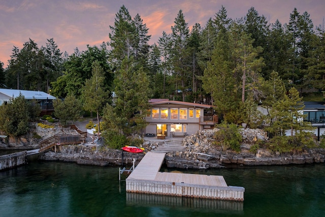 21347 Hydeaway Rd, Rollins, MT 59931 - dock area featuring stairway and a deck with water view