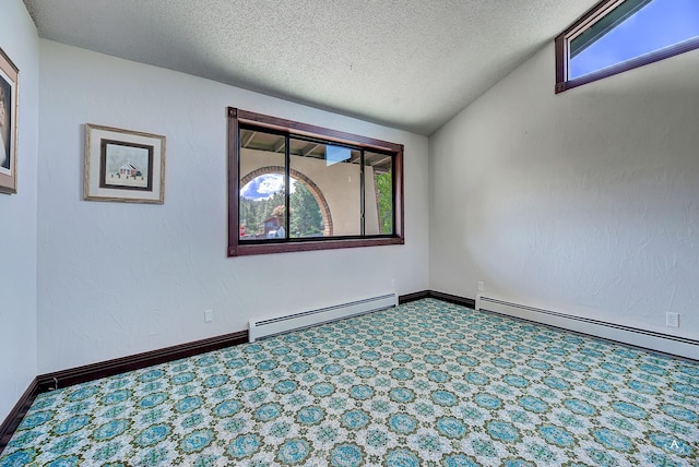 1644 Gold Rush Ave, Helena, MT 59601 - unfurnished room featuring baseboard heating, plenty of natural light, a textured ceiling, and baseboards