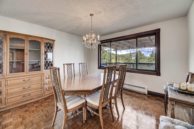 1644 Gold Rush Ave, Helena, MT 59601 - dining area with a chandelier, a textured ceiling, and baseboards