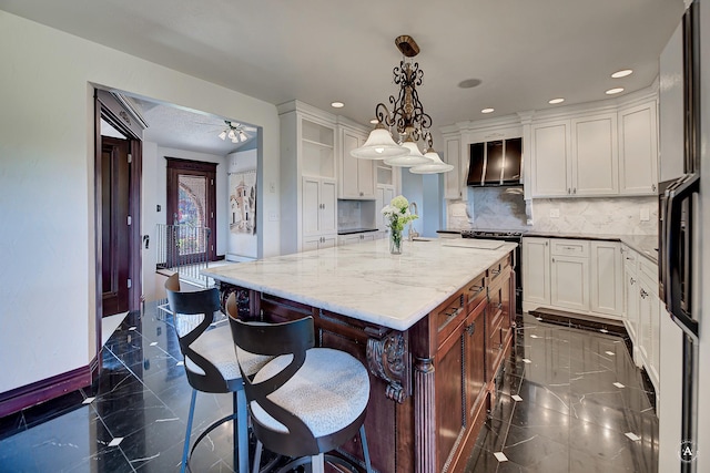 1644 Gold Rush Ave, Helena, MT 59601 - kitchen featuring range hood, light stone countertops, white cabinetry, tasteful backsplash, and a center island