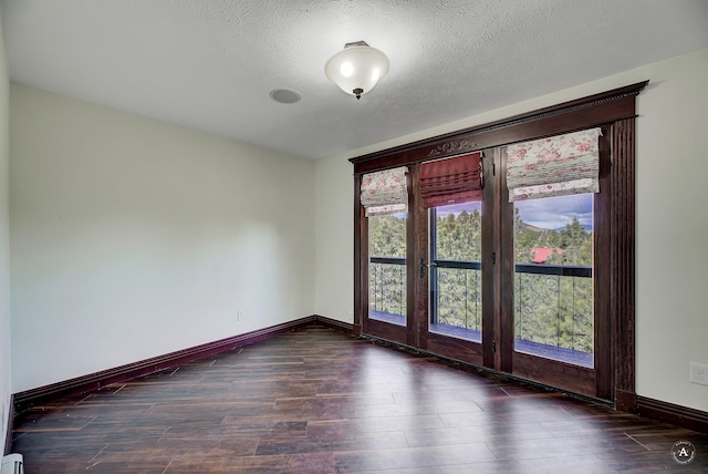 1644 Gold Rush Ave, Helena, MT 59601 - empty room featuring wood finished floors, baseboards, and a textured ceiling