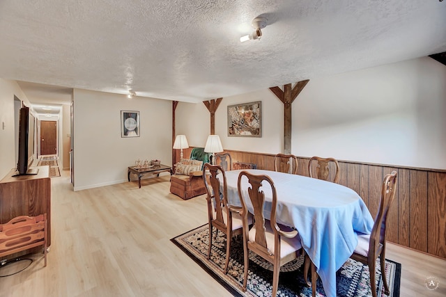 1644 Gold Rush Ave, Helena, MT 59601 - dining area featuring a textured ceiling and light wood finished floors