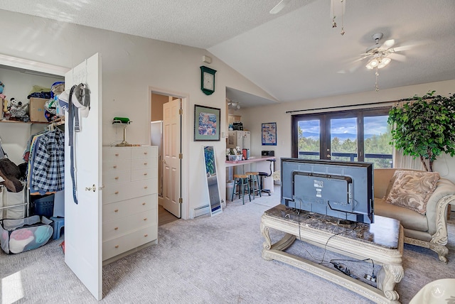 1644 Gold Rush Ave, Helena, MT 59601 - carpeted living area featuring vaulted ceiling, ceiling fan, and a textured ceiling