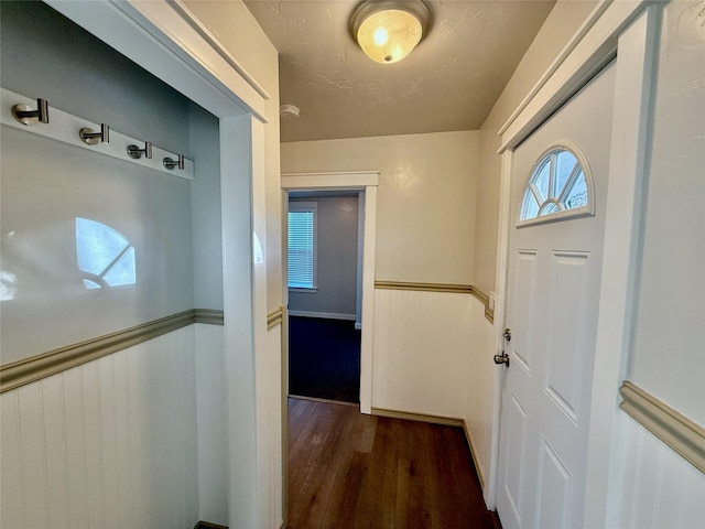 506 1st Ave E Unit A, B, C, Eureka, MT 59917 - hall featuring dark wood-style floors and a wainscoted wall