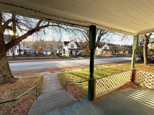 506 1st Ave E Unit A, B, C, Eureka, MT 59917 - covered porch with a residential view